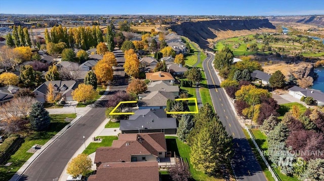 birds eye view of property with a residential view