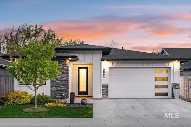 prairie-style house featuring a garage