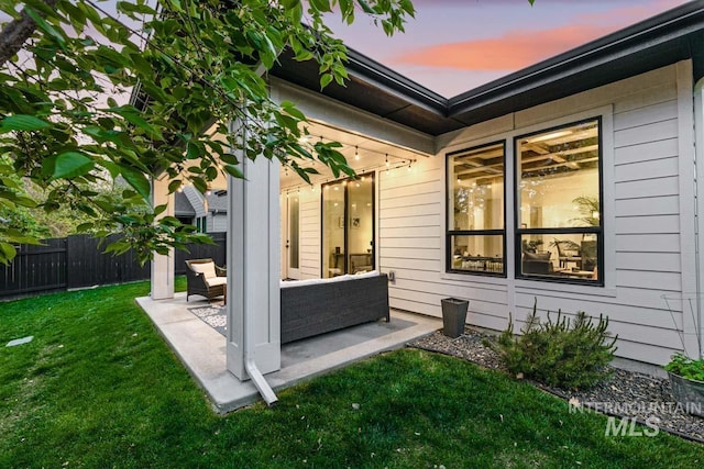 exterior space featuring an outdoor hangout area and a yard