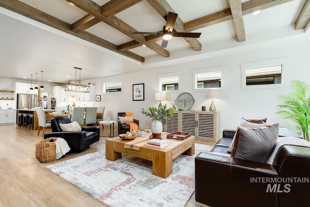 living room featuring coffered ceiling, ceiling fan, beam ceiling, and light hardwood / wood-style flooring