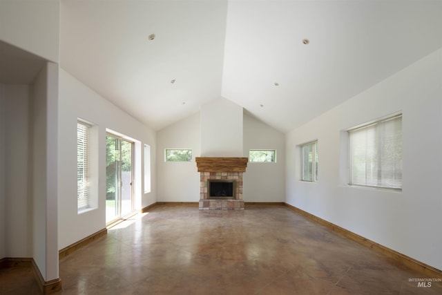 205 Shaun Ln, Hailey, ID 83333 - unfurnished living room with a stone fireplace, high vaulted ceiling, and baseboards