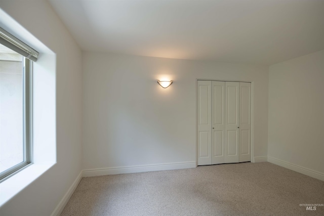 205 Shaun Ln, Hailey, ID 83333 - unfurnished bedroom featuring light carpet, baseboards, and a closet