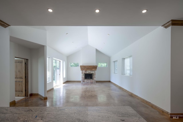 205 Shaun Ln, Hailey, ID 83333 - unfurnished living room featuring a stone fireplace, baseboards, vaulted ceiling, and recessed lighting