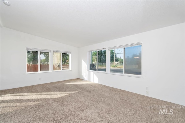 1404 River Run Ln, Caldwell, ID 83605 - carpeted spare room featuring lofted ceiling and a smoke detector
