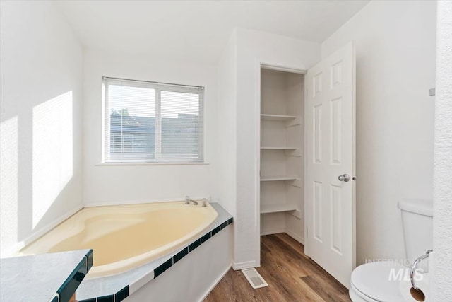 1404 River Run Ln, Caldwell, ID 83605 - full bathroom featuring wood finished floors and a garden tub