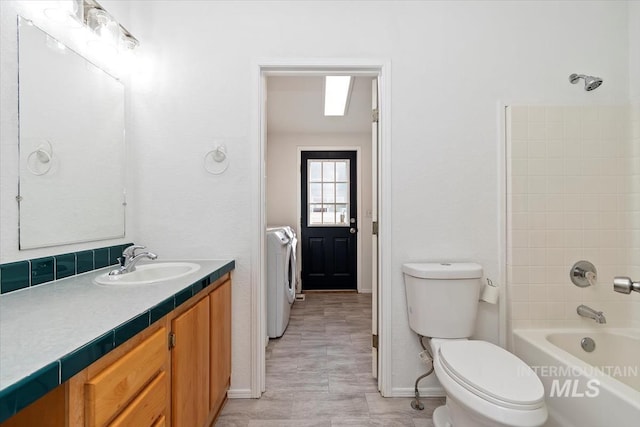 1404 River Run Ln, Caldwell, ID 83605 - bathroom featuring vanity, tub / shower combination, and washer and dryer