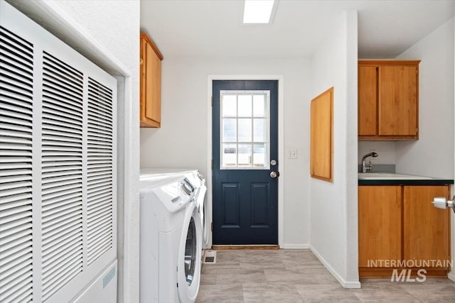 1404 River Run Ln, Caldwell, ID 83605 - laundry room featuring a heating unit, cabinet space, and separate washer and dryer
