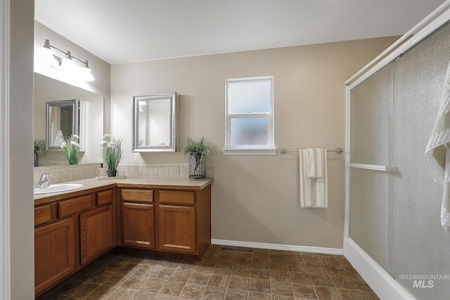 bathroom with vanity and baseboards