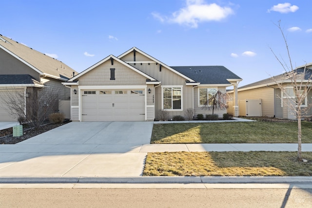 view of front facade featuring a front lawn and a garage