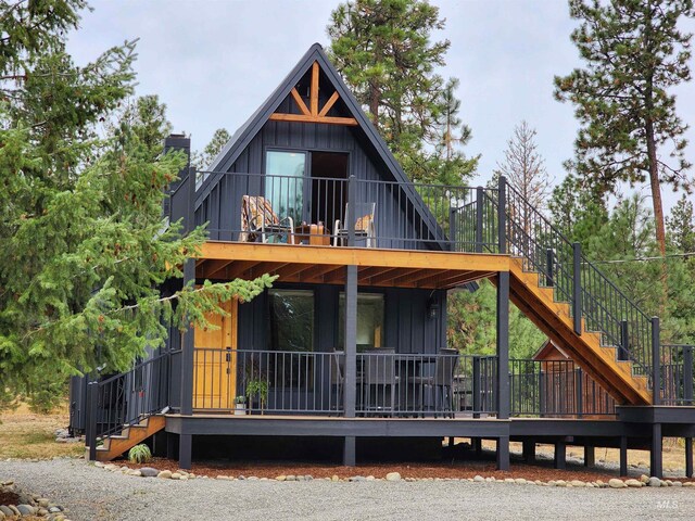 85 Cottage Rd, Anatone, WA 99401 - view of front of home featuring stairway, board and batten siding, and covered porch