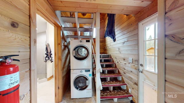 85 Cottage Rd, Anatone, WA 99401 - laundry room with stacked washer and clothes dryer and wood walls