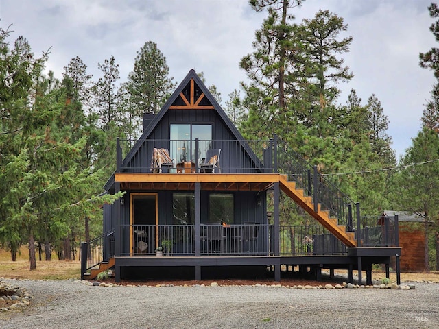 85 Cottage Rd, Anatone, WA 99401 - view of front of house featuring stairs, board and batten siding, and a balcony