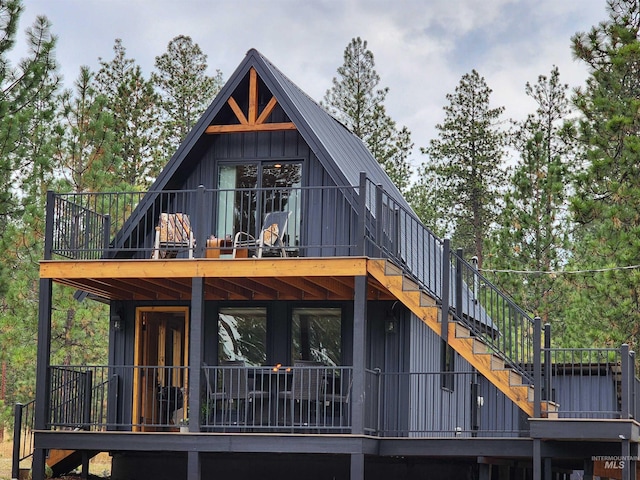 85 Cottage Rd, Anatone, WA 99401 - back of house with board and batten siding, a wooden deck, and stairway