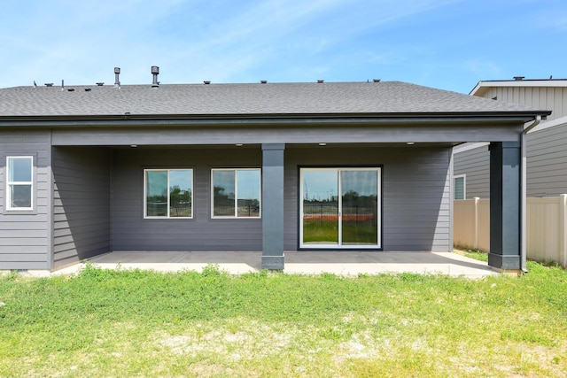 8569 W Pond Pine St, Star, ID 83669 - rear view of house featuring a patio area and roof with shingles
