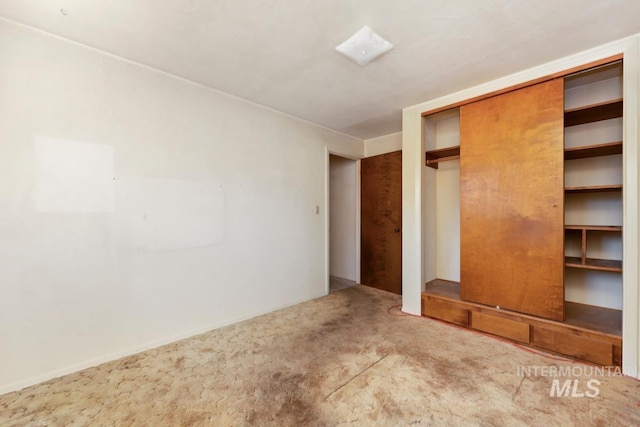 unfurnished bedroom featuring carpet flooring