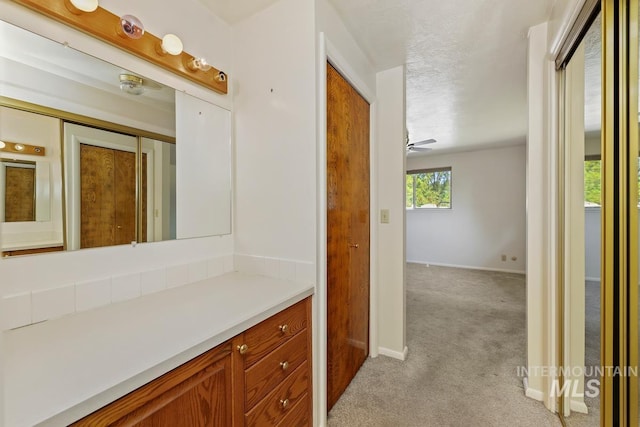 bathroom featuring vanity and baseboards