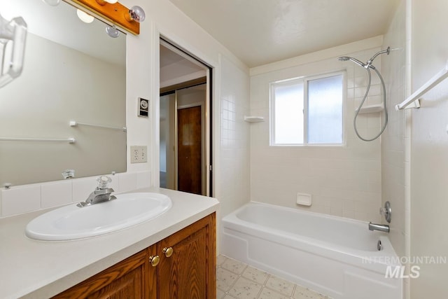 bathroom featuring bathing tub / shower combination and vanity