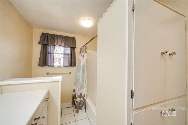 bathroom featuring shower / tub combo and tile patterned floors
