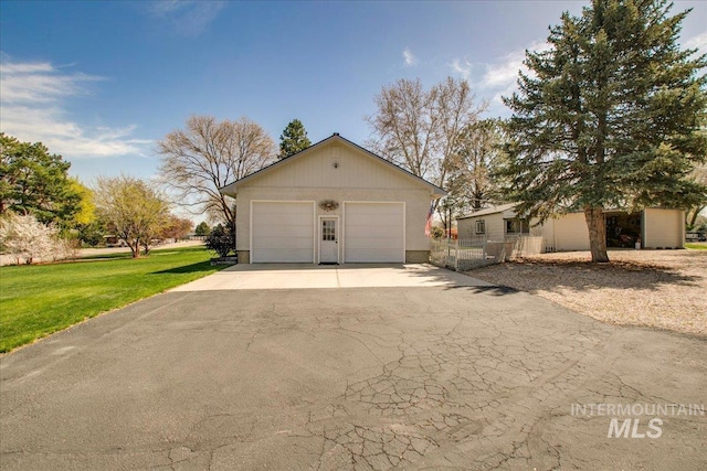 garage with aphalt driveway