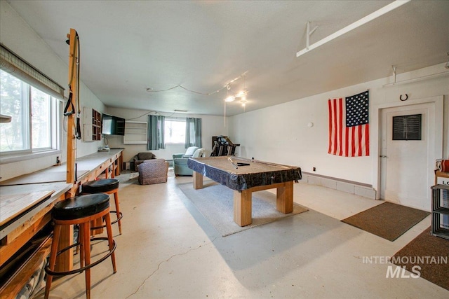 rec room featuring pool table and finished concrete floors