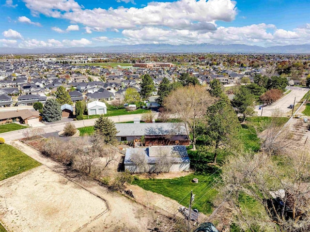 drone / aerial view with a residential view and a mountain view