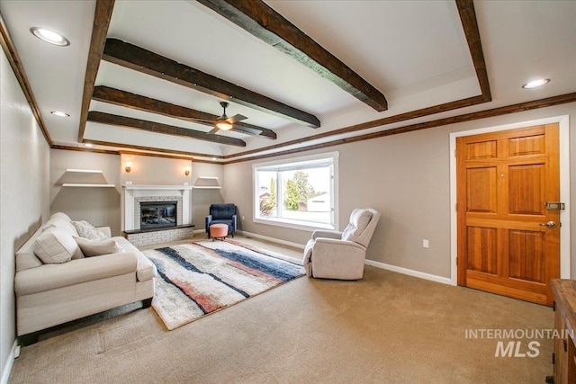 living room with carpet flooring, baseboards, recessed lighting, ceiling fan, and a fireplace