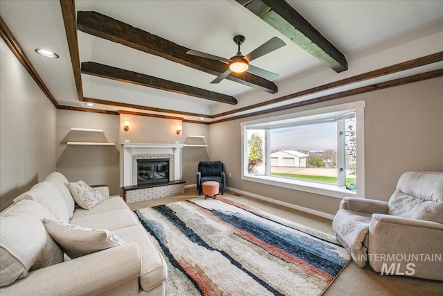 carpeted living area featuring recessed lighting, beam ceiling, baseboards, a fireplace, and ceiling fan