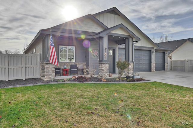 view of front of house featuring a garage and a front lawn