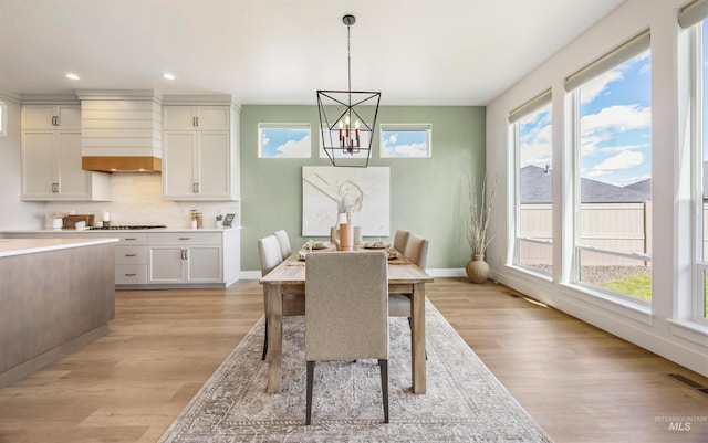 5222 S Montague Way, Meridian, ID 83642 - dining room featuring light wood-style floors, a chandelier, recessed lighting, and baseboards