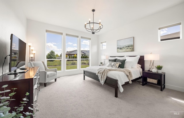5222 S Montague Way, Meridian, ID 83642 - bedroom with a chandelier, light colored carpet, and baseboards