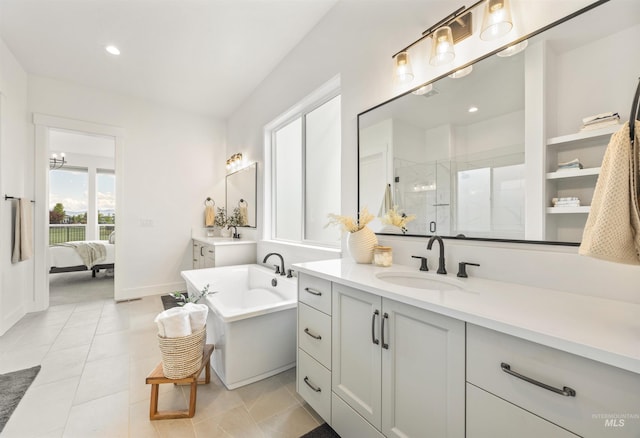 5222 S Montague Way, Meridian, ID 83642 - full bathroom with a shower stall, two vanities, ensuite bathroom, a freestanding tub, and recessed lighting