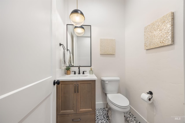 5222 S Montague Way, Meridian, ID 83642 - bathroom with vanity, toilet, baseboards, and tile patterned flooring
