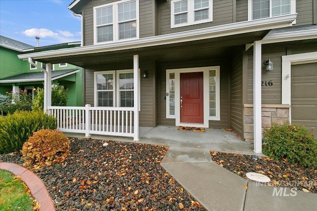 property entrance featuring covered porch