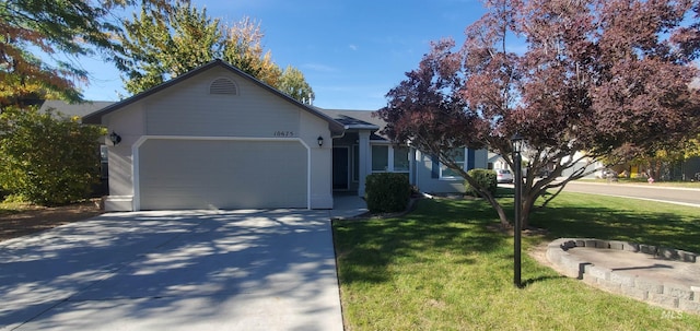 ranch-style house featuring a garage, concrete driveway, and a front lawn