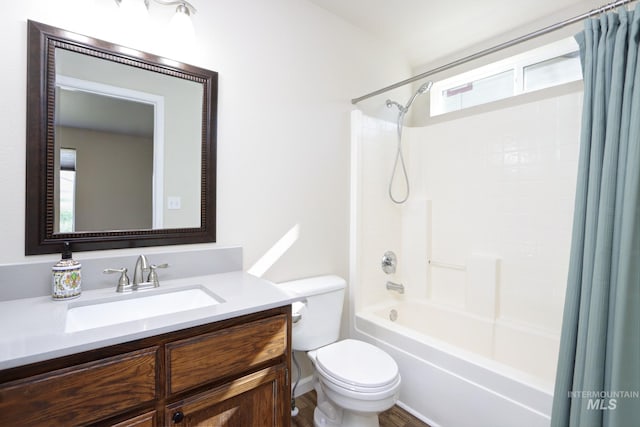 full bath with shower / bath combination with curtain, vanity, and toilet