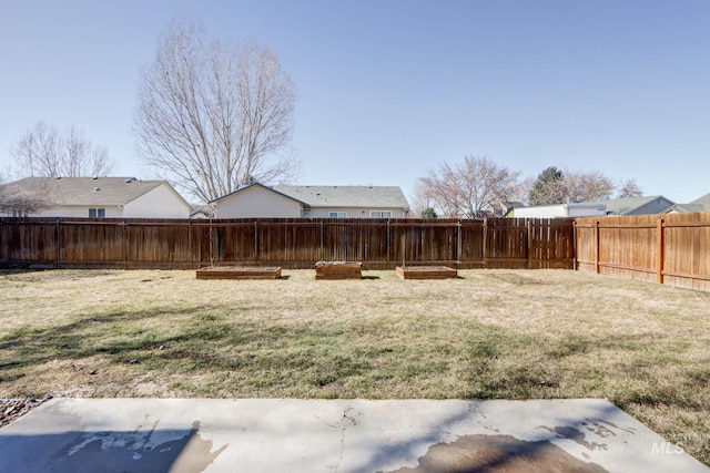 view of yard with a fenced backyard