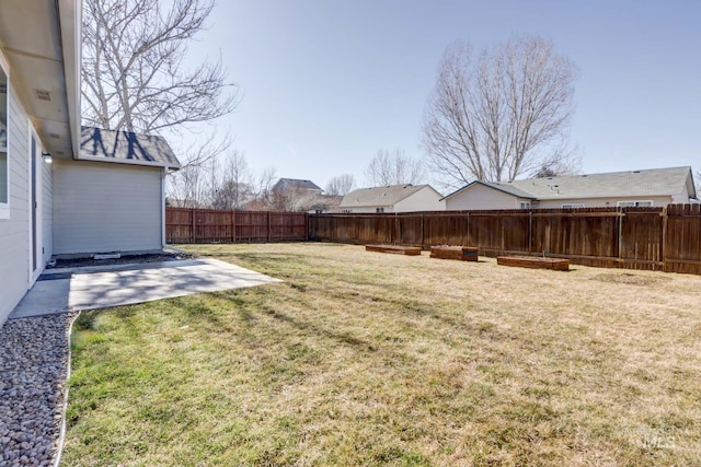 view of yard with a patio and a fenced backyard