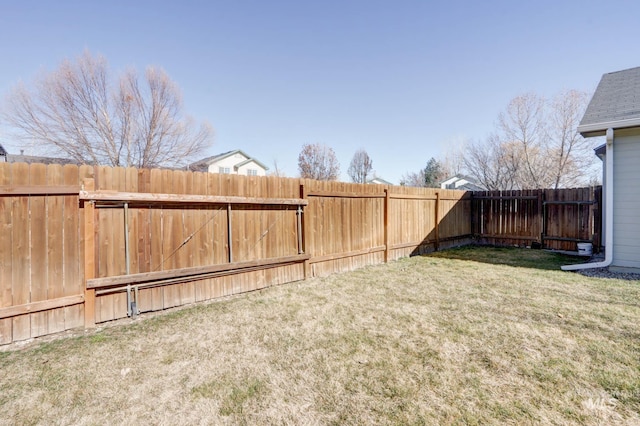 view of yard with a fenced backyard