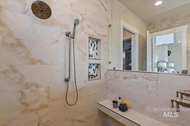 full bathroom with tiled shower