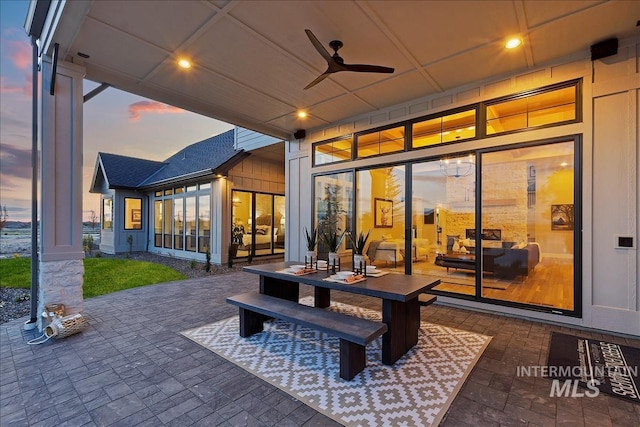 patio terrace at dusk with ceiling fan