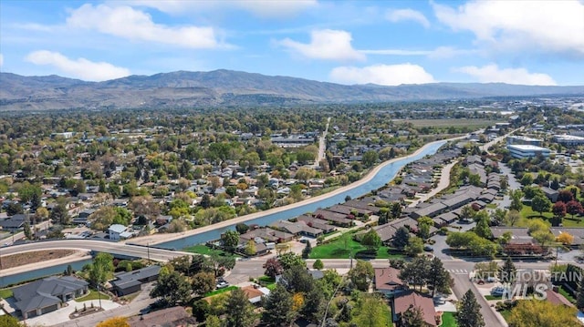 drone / aerial view featuring a residential view and a mountain view