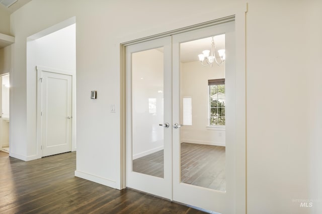 8235 W Tether St, Boise, ID 83709 - doorway to outside with french doors, dark wood finished floors, a chandelier, and baseboards