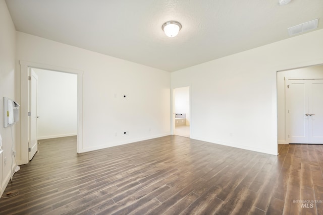 8235 W Tether St, Boise, ID 83709 - empty room with dark wood-style flooring and baseboards