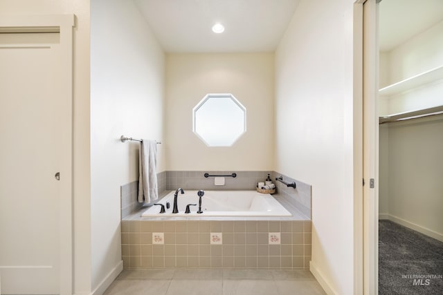 8235 W Tether St, Boise, ID 83709 - bathroom with a garden tub and tile patterned flooring
