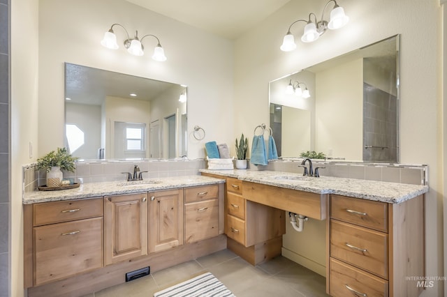 8235 W Tether St, Boise, ID 83709 - full bath featuring vanity, tile patterned flooring, and backsplash