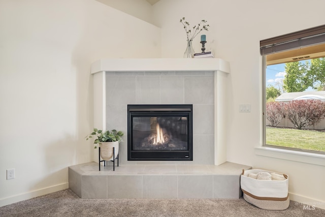 8235 W Tether St, Boise, ID 83709 - detailed view of carpet floors, a tiled fireplace, and baseboards