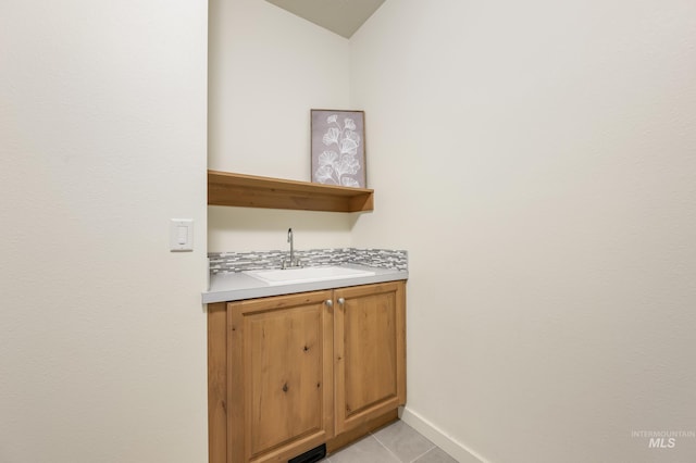 8235 W Tether St, Boise, ID 83709 - indoor wet bar featuring light tile patterned floors and baseboards