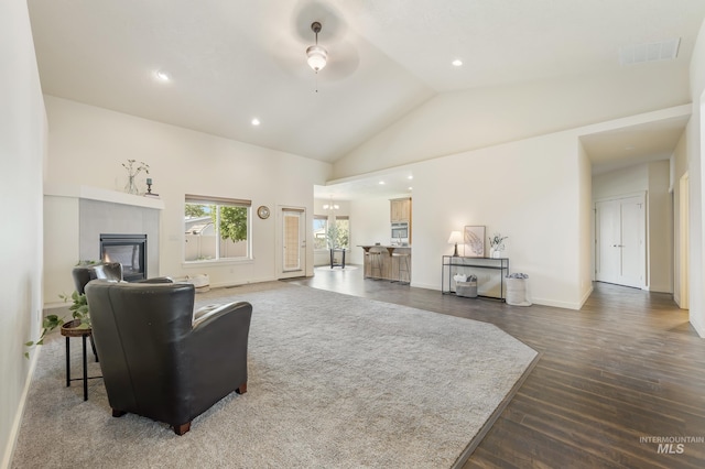 8235 W Tether St, Boise, ID 83709 - living area featuring lofted ceiling, wood finished floors, a tile fireplace, ceiling fan, and recessed lighting