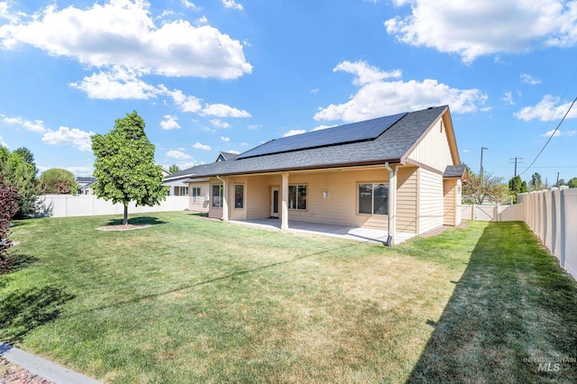 8235 W Tether St, Boise, ID 83709 - rear view of property with roof mounted solar panels, a patio, roof with shingles, and a gate