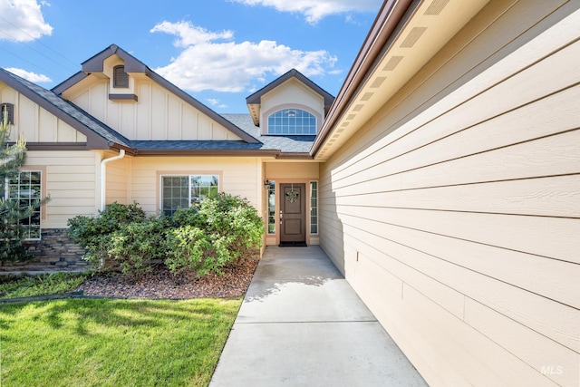 8235 W Tether St, Boise, ID 83709 - entrance to property with board and batten siding and a shingled roof
